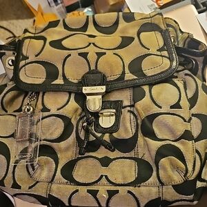 Coach Poppy Signature Lurex Flap Backpack.